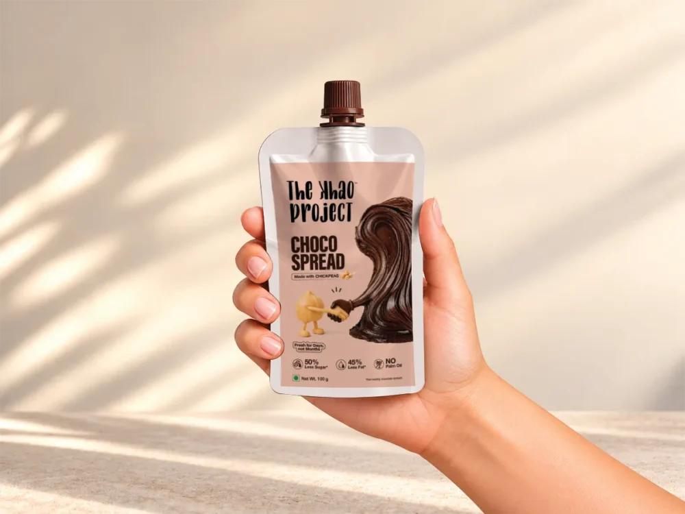 The Khao Project Choco Spread squeeze pouch held in hand